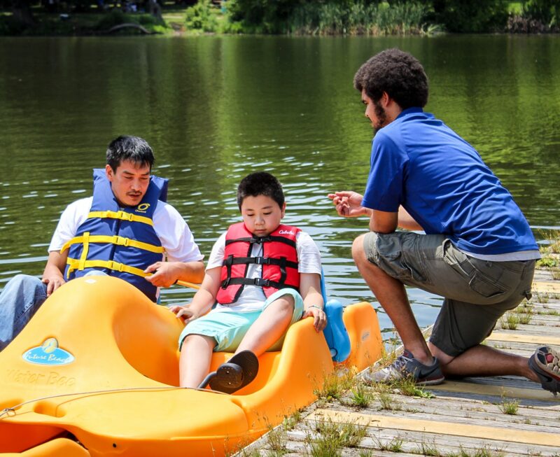 Boys in yellow pedal boat